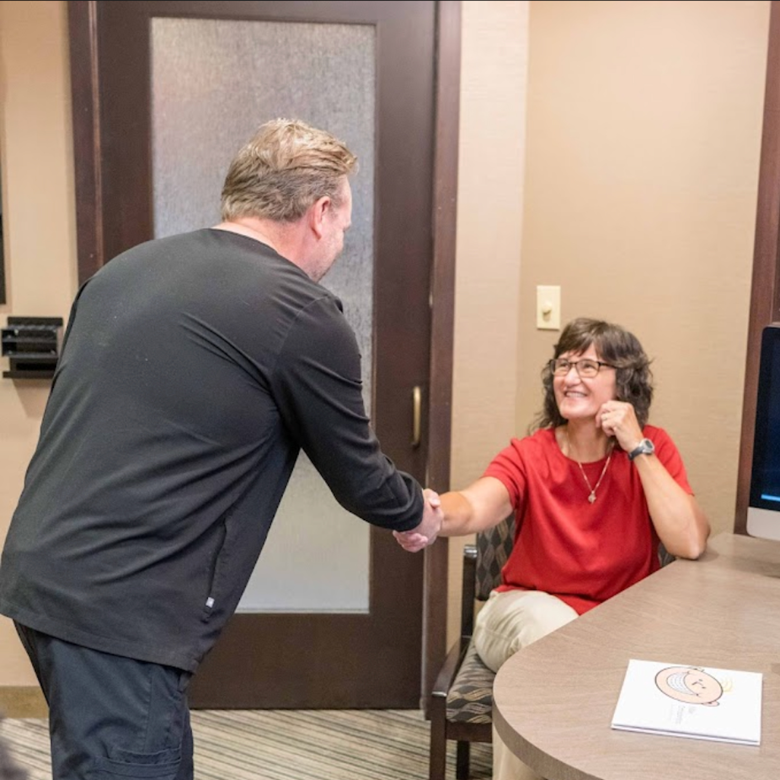 Dr Miller Shaking Hands With Patient